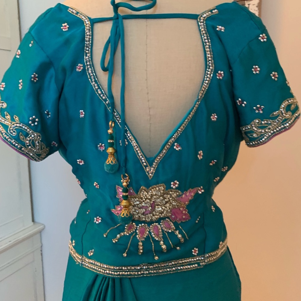 Delicate teal and pink sari with jeweled detail